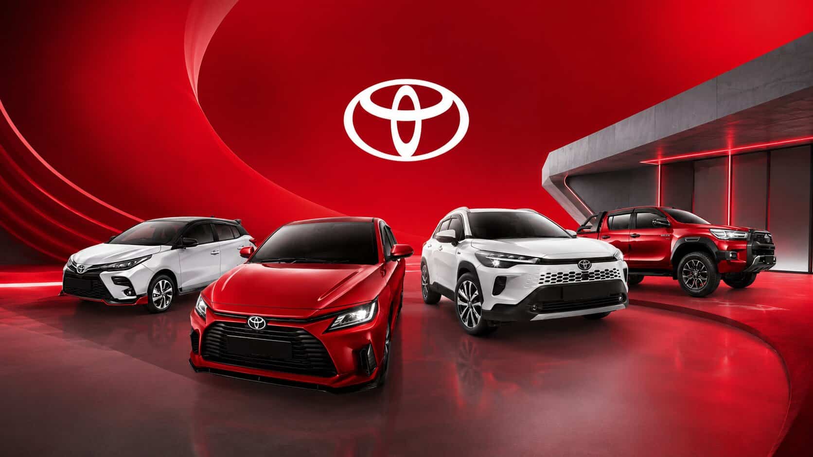 Toyota cars showcased at the Toyota Malaysia event with a red background.